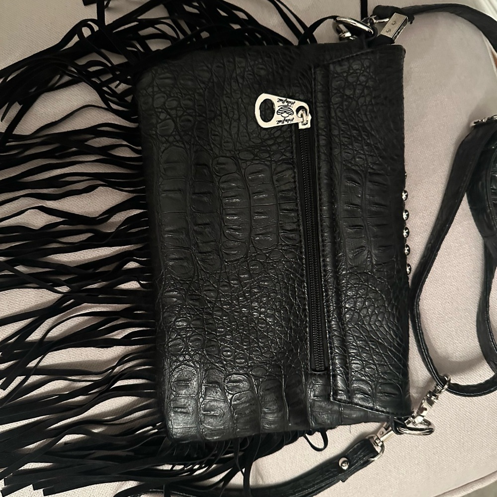 Leather purse with fringe and sequins